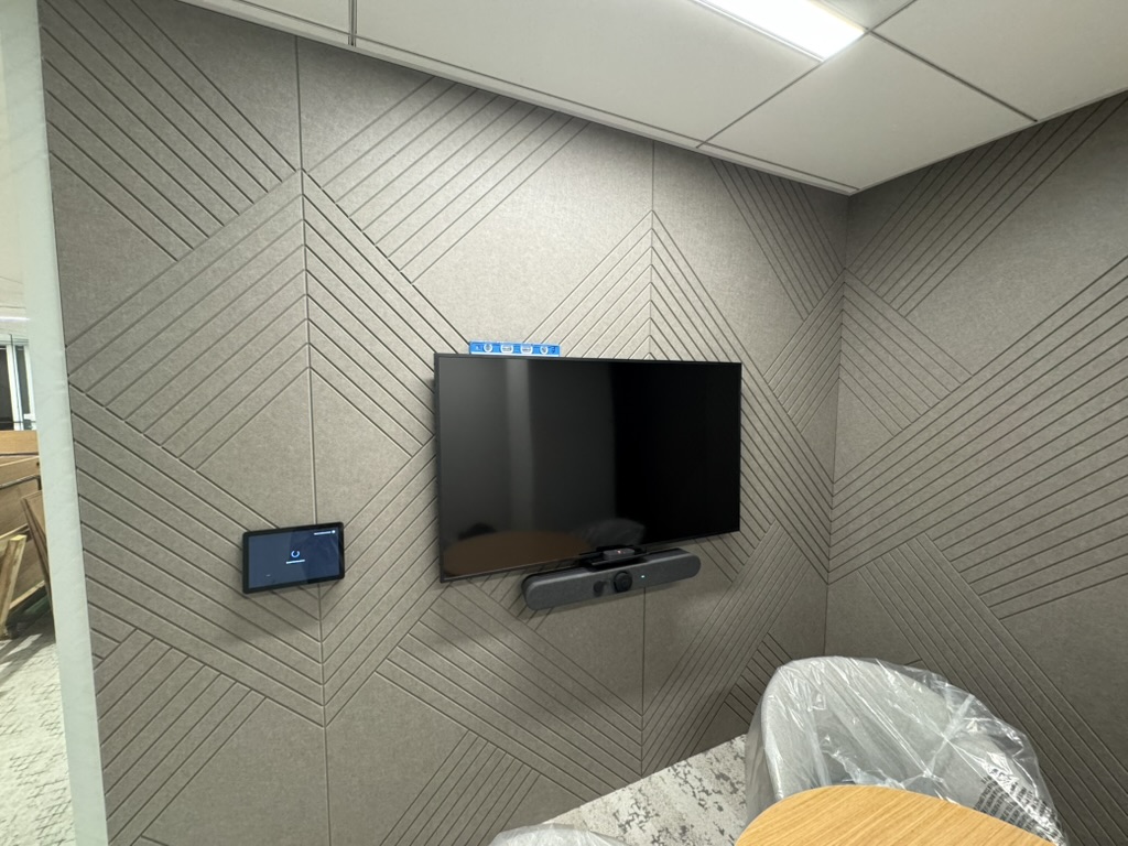 Finished conference room display, soundbar, and control panel at Boston Properties