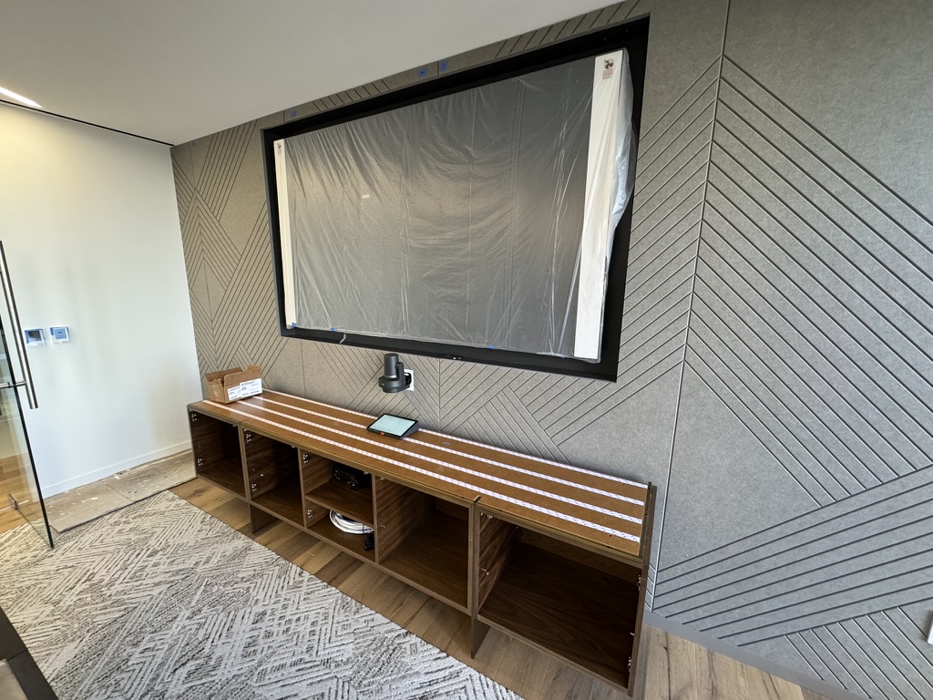 Conference room display wall and credenza during installation at Boston Properties