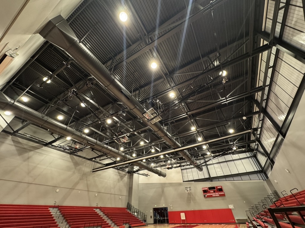 Finished ceiling and overhead systems in the main gym at Burlingame High School