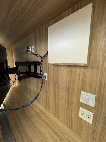 Classroom control panel and wall-mounted AV hardware at Cesar Chavez Middle School