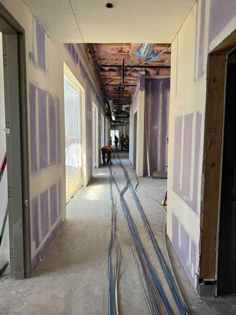 Long hallway cable pulls during the JLS Middle School addition rough-in