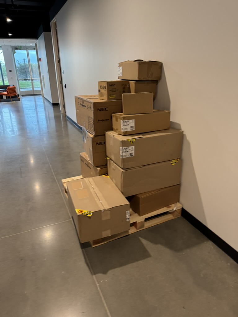 Projector and related AV materials staged for the KLA-AHA job