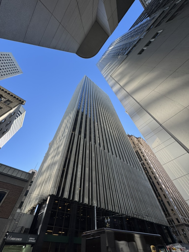Street-level view looking up at the Sansome-area building in San Francisco.
