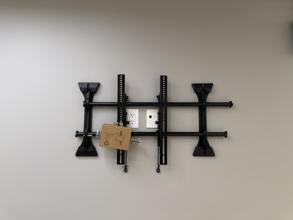 TV mount installation in the Sansome tenant workout room