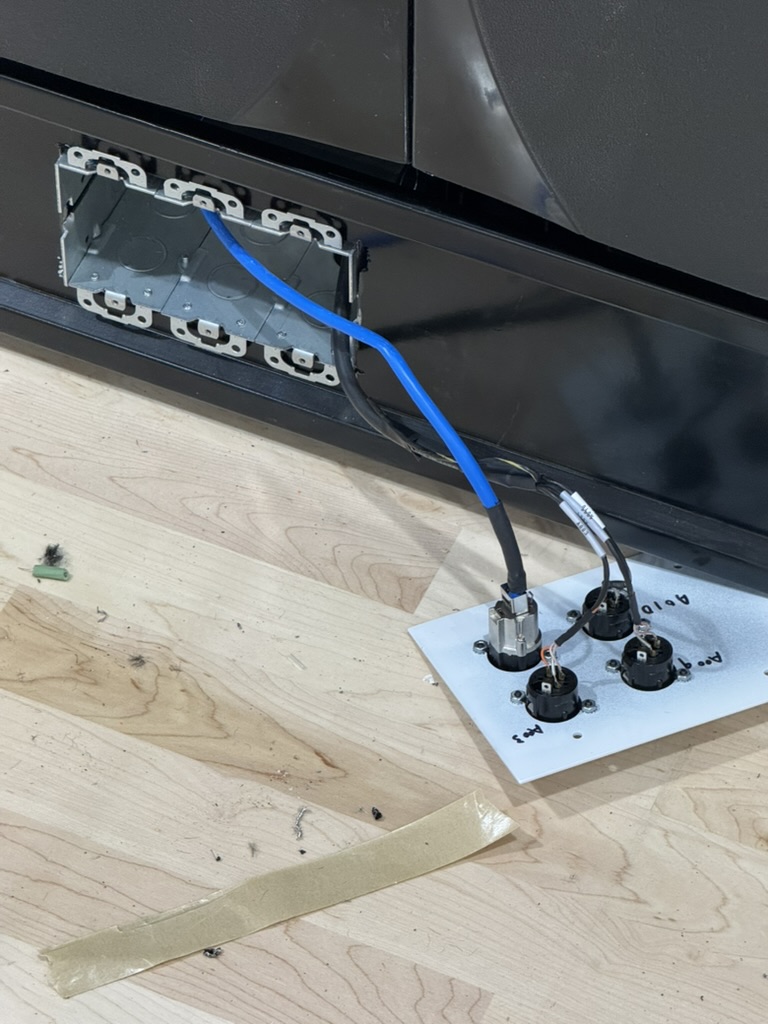 ALS rough-in and XLR connector work under the bleachers at Tennyson High School